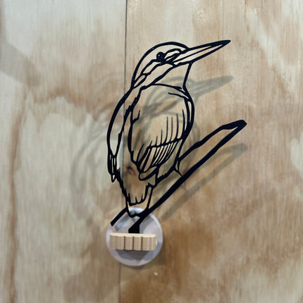 Ijsvogel aan de muur