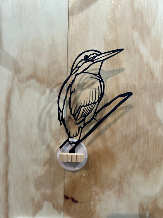 Ijsvogel aan de muur