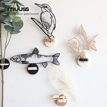 Ijsvogel aan de muur